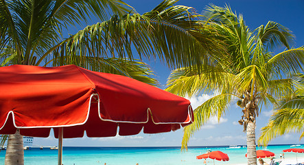 Image showing Red Beach Umbrellas and turquoise Waters of Caribbean