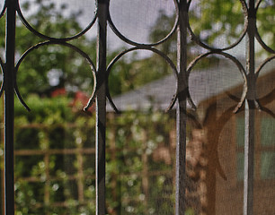 Image showing Courtyard and Garden seen from a Window with Grate