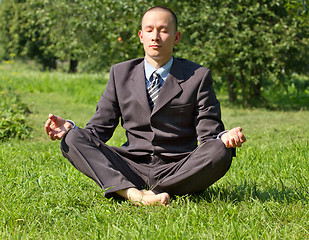 Image showing Businessman Meditating Outdoors 