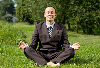 Image showing Businessman Meditating Outdoors 