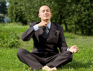 Image showing Businessman Meditating Outdoors 