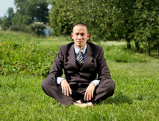 Image showing Businessman Meditating Outdoors 