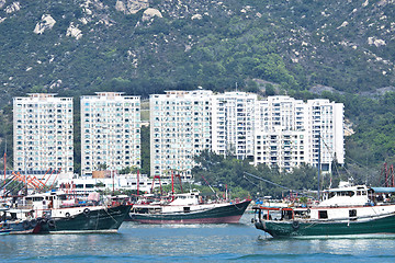 Image showing Fishing boats and apartment blocks in Hong Kong