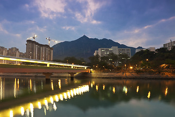 Image showing Sunset along the river in city