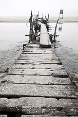 Image showing Desolated wooden pier in low saturation