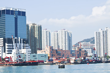Image showing Hong Kong apartment blocks and fishing boats at coast