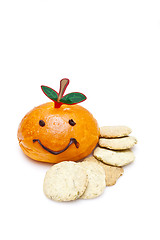 Image showing Orange smiley bread with biscuits on white background