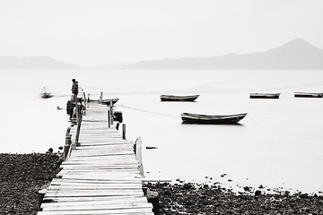 Image showing Lonely pier along the coast, low saturation image.