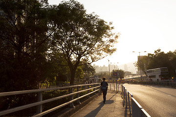 Image showing Sunset walkway along the road