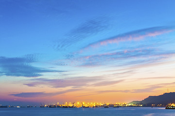 Image showing Sunset ocean with catgo ships 