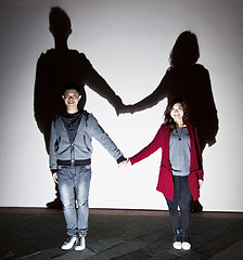 Image showing Asian stylish couple on street holding hands
