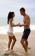 Image showing A man and woman enjoy life at the beach