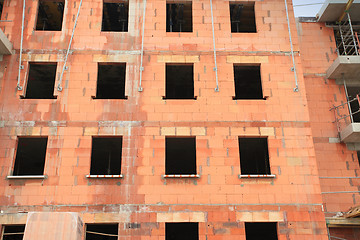 Image showing residential building under construction in red brick