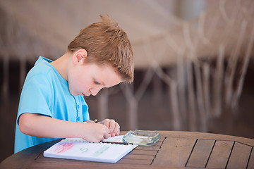 Image showing Boy drawing or writing