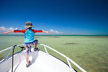 Image showing Little boy facing ocean