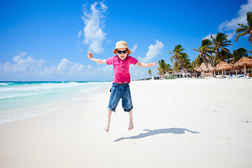 Image showing Happy boy jumping on beach