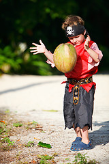 Image showing Boy dressed as pirate with coconut