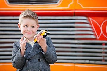 Image showing Boy outdoors with toy