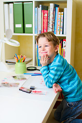 Image showing Cute little boy studying