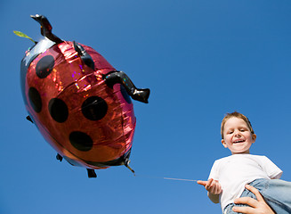 Image showing Little boy and balloon