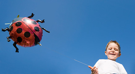 Image showing Little boy and balloon