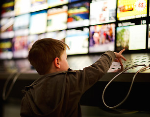 Image showing Boy in music store