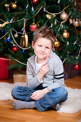 Image showing Boy near Christmas tree