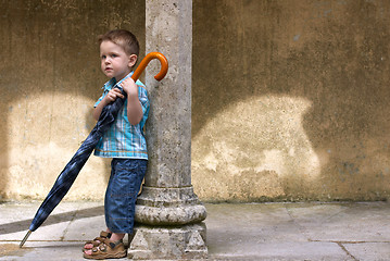 Image showing Little one with big umbrella