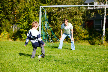 Image showing Family playing football