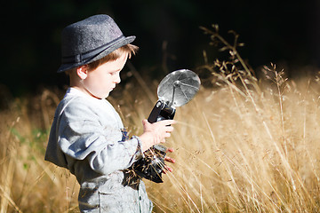 Image showing Boy with retro camera