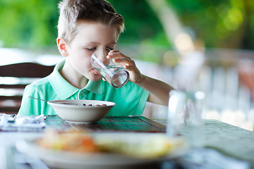 Image showing Little boy drinking water
