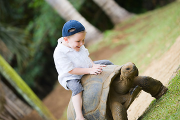 Image showing Riding Giant Turtle