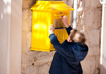 Image showing Boy sending letter