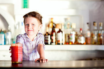 Image showing Cute boy at bar