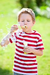 Image showing Blowing soap bubbles