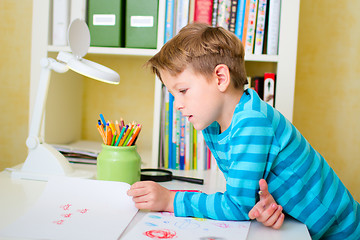 Image showing School boy doing homework at home