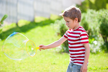 Image showing Making soap bubbles