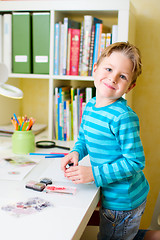 Image showing Cute little boy studying