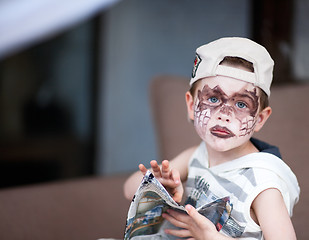 Image showing Boy with face painted