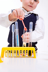 Image showing  Boy practicing chemistry