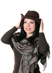 Image showing Female trying on a brown felt hat