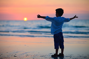 Image showing Little boy at sunset