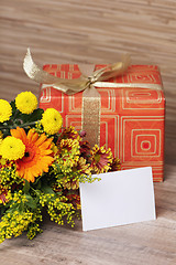 Image showing  giftbox and a bouquet of flowers 