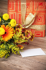 Image showing  giftbox and a bouquet of flowers 