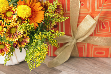 Image showing  giftbox and a bouquet of flowers 