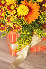 Image showing  giftbox and a bouquet of flowers 