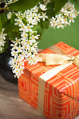 Image showing Branch blossoming a spring tree and a box with a gift