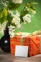 Image showing Branch blossoming a spring tree and a box with a gift