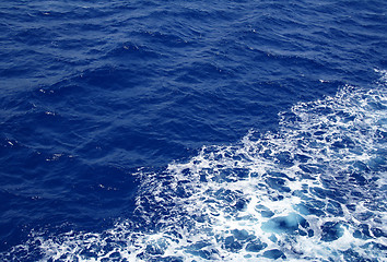 Image showing Dark blue sea water surface with ripple as background 