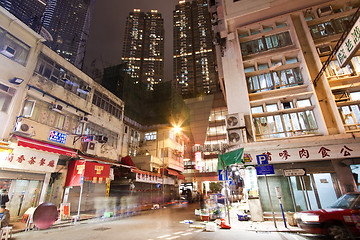 Image showing Hong Kong downtown at night - old apartments and modern building